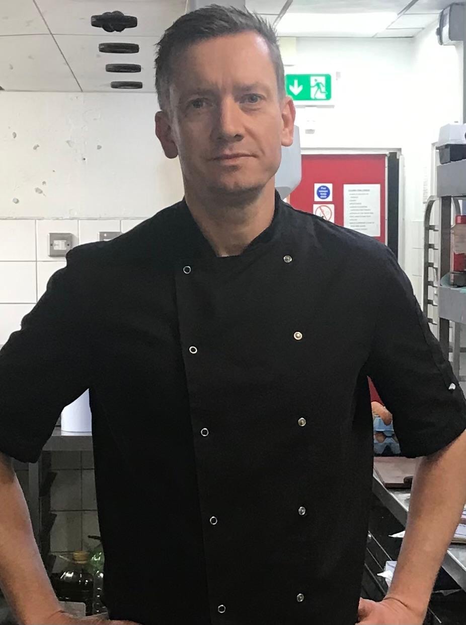 Pawel, the chef behind BoxChef, in his kitchen in chef’s whites